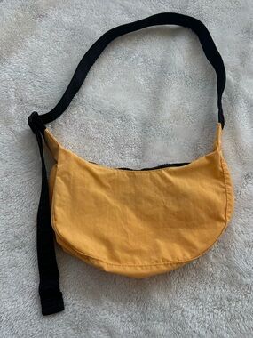 Small light orange Baggu Crescent bag
